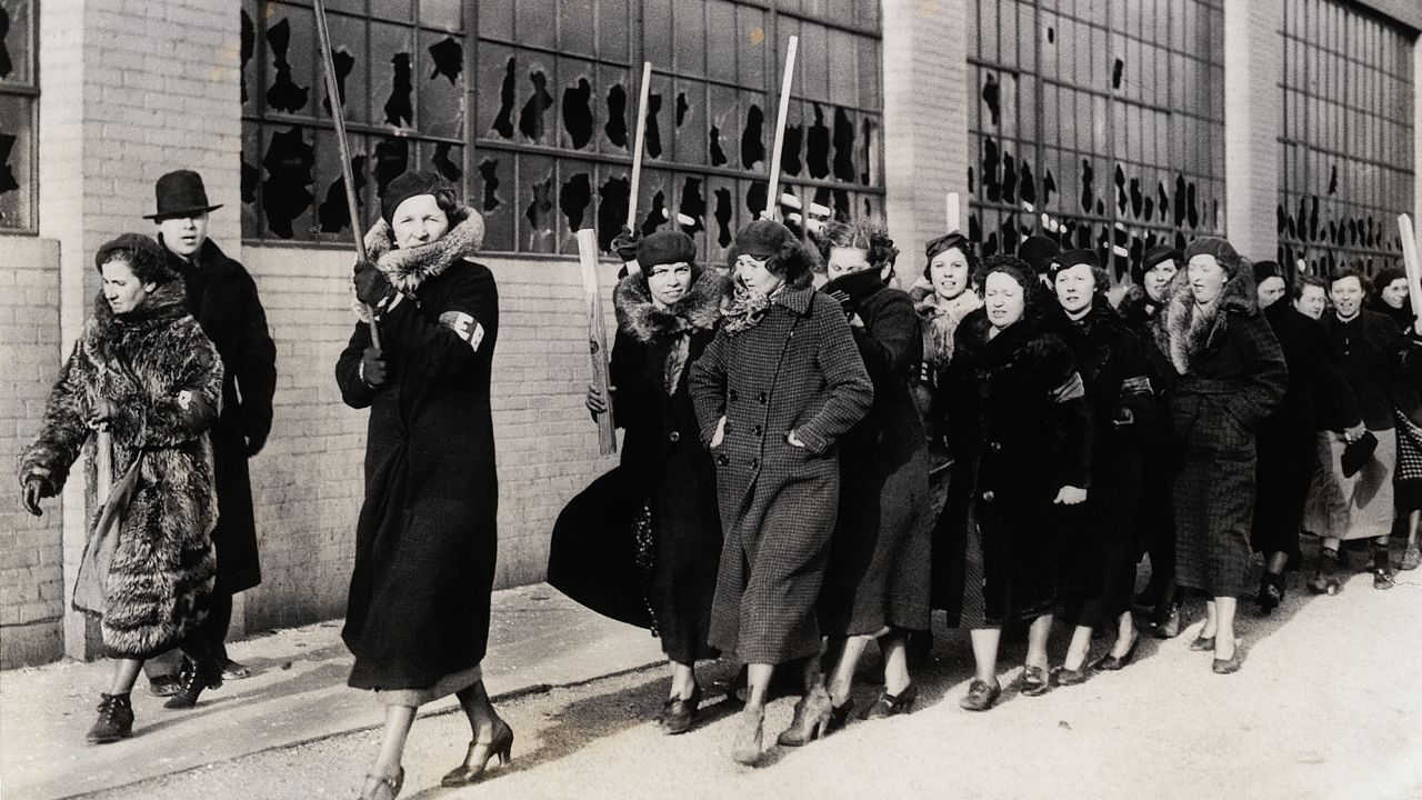A march of strikers' wives following the riot between strikers and policemen on February 1, 1937, in Flint.
