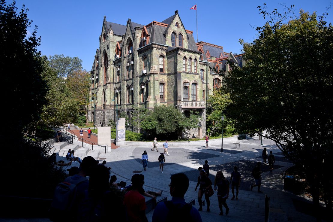 Students walk between classes in front of College Hall on the campus of the University of Pennsylvania in Philadelphia, Pennsylvania, U.S., September 25, 2017.